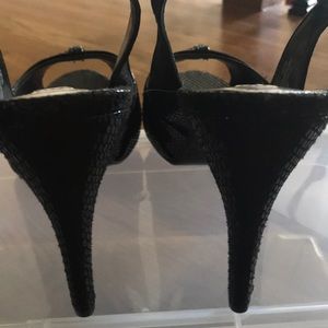 Black open toe high heeled sandals.